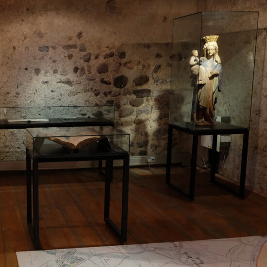 Glass display cases containing exhibits on the town’s history at the Kitzbühel Museum