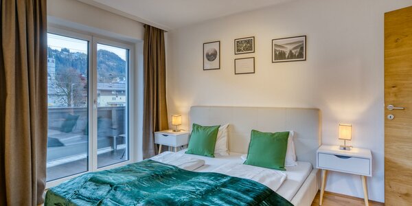 Apartment Tristkogel Schlafzimmer Wald mit Bett