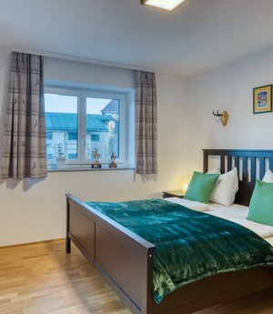 Apartment Wilder Kaiser Bett im Schlafzimmer