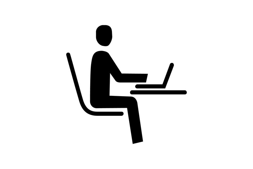 Schwarzes Piktogramm einer sitzenden Person, die an einem Laptop an einem Tisch arbeitet.